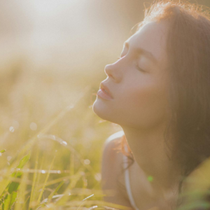 Woman relaxing outdoors enjoying sunlight during a rejuvenation weekend in Altea